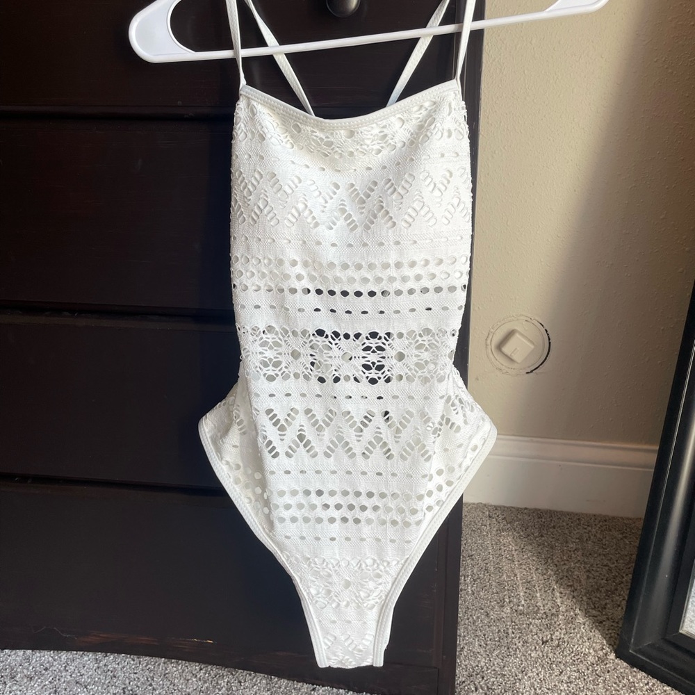 Size Medium one piece swimsuit with cutouts.